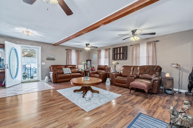 living room with light hardwood / wood-style floors and beam ceiling