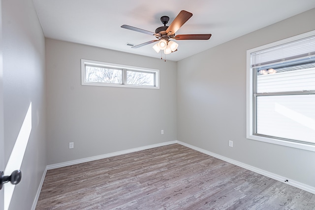 unfurnished room with light wood-type flooring and ceiling fan