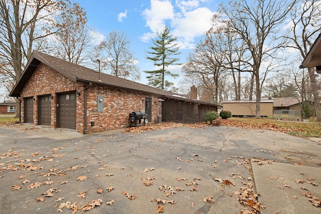 view of property exterior featuring a garage