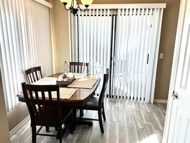 dining room featuring a chandelier and hardwood / wood-style floors