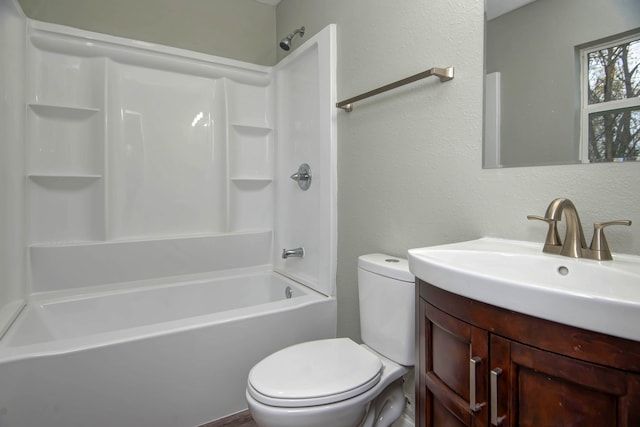 full bathroom featuring bathing tub / shower combination, vanity, and toilet