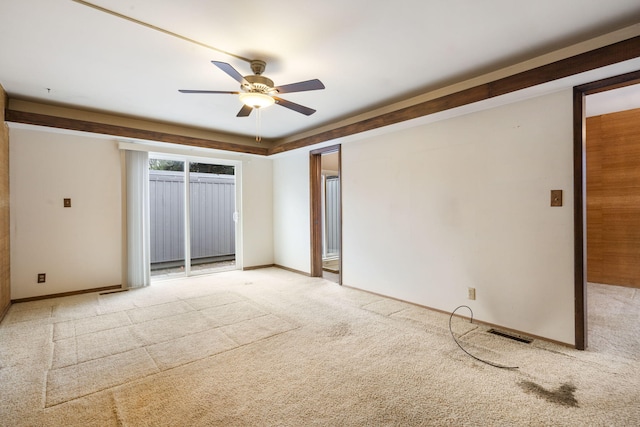 empty room with light colored carpet and ceiling fan