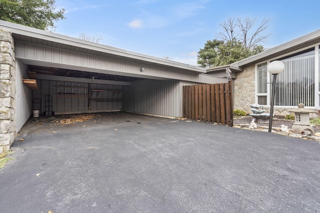 view of side of home featuring a carport