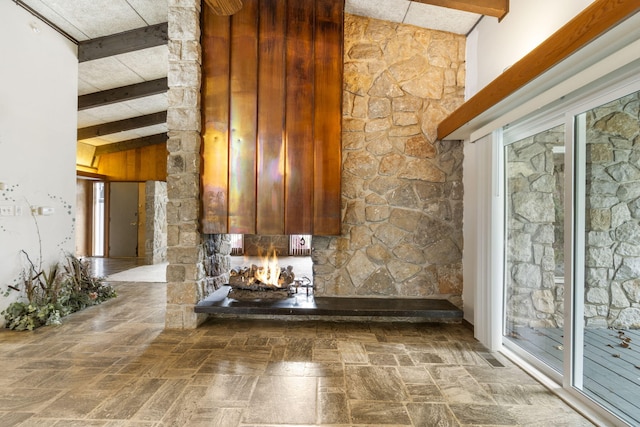 interior space with vaulted ceiling with beams