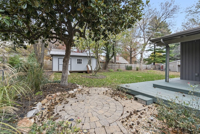 view of yard with an outdoor structure and a deck