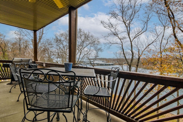 balcony with a grill and a deck with water view