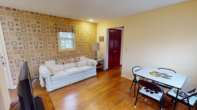 15047 E Peace Rd, Nevada, MO 64772 - living room with wood finished floors, baseboards, recessed lighting, and wallpapered walls