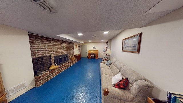 15047 E Peace Rd, Nevada, MO 64772 - living room featuring a fireplace, a textured ceiling, and recessed lighting