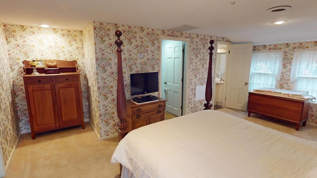 15047 E Peace Rd, Nevada, MO 64772 - bedroom featuring wallpapered walls, light colored carpet, and baseboards