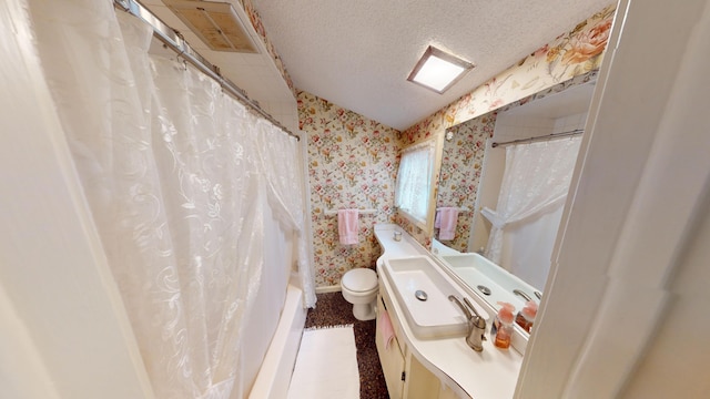 bathroom featuring a shower with curtain, vanity, a textured ceiling, vaulted ceiling, and toilet