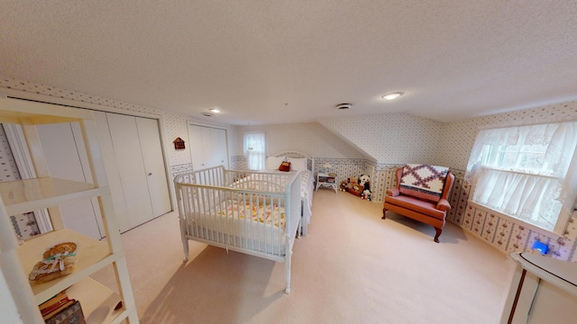 15047 E Peace Rd, Nevada, MO 64772 - bedroom featuring wallpapered walls, multiple windows, carpet flooring, and a textured ceiling
