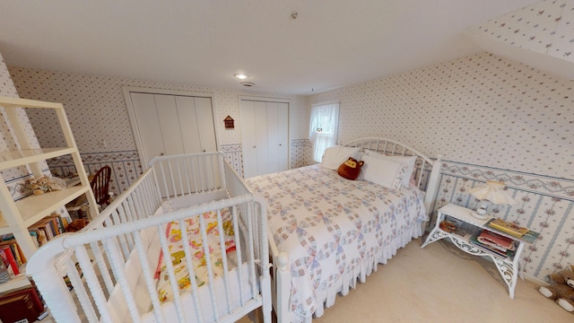 bedroom featuring light carpet