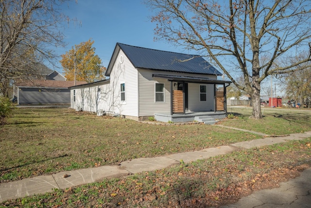 view of front of property with a porch and a front yard