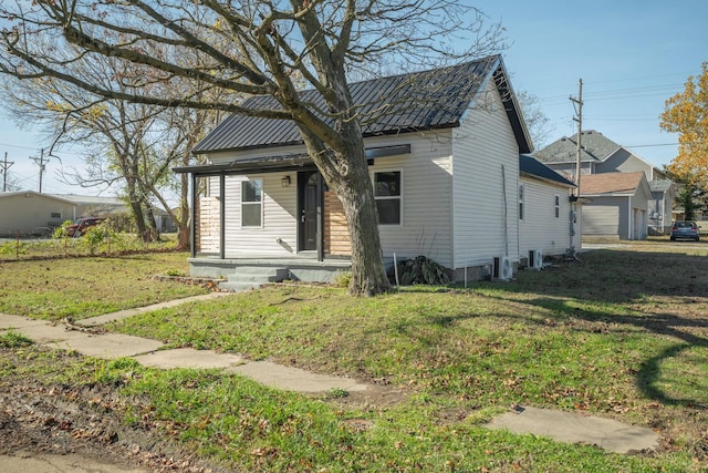 bungalow-style house with a front lawn