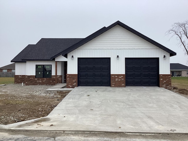 modern inspired farmhouse featuring a garage