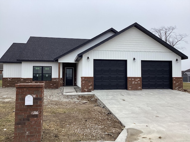 modern inspired farmhouse featuring a garage