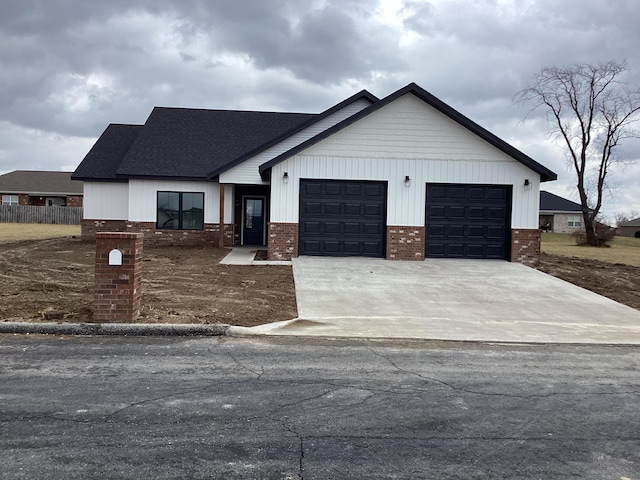 modern inspired farmhouse featuring a garage