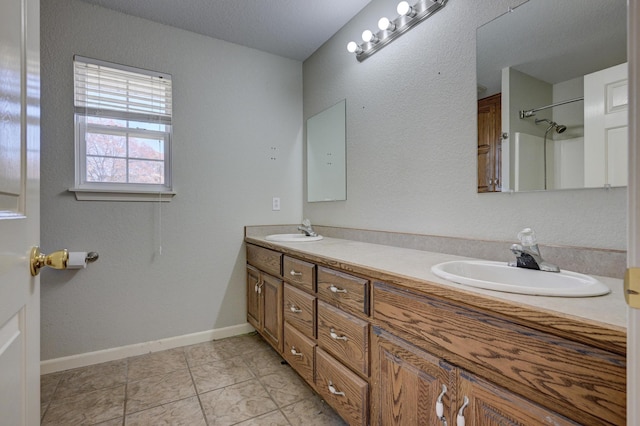 bathroom with tile patterned flooring and vanity