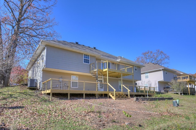 rear view of property with central AC unit