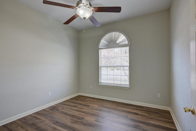 unfurnished room featuring dark hardwood / wood-style flooring and ceiling fan