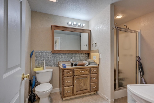 bathroom with decorative backsplash, a shower with door, a textured ceiling, and tile patterned flooring