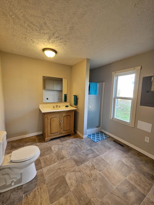 bathroom featuring vanity, a textured ceiling, electric panel, toilet, and a shower with shower door