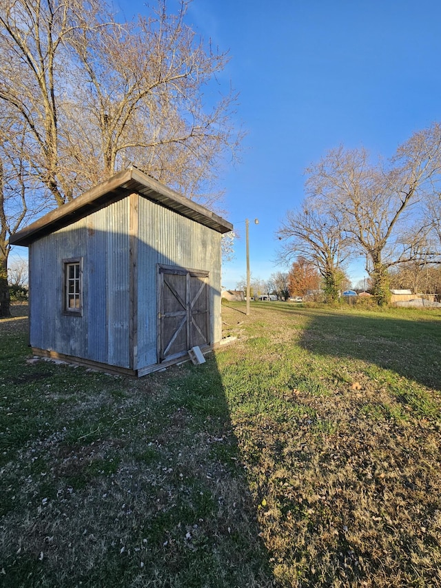 view of outdoor structure with a lawn