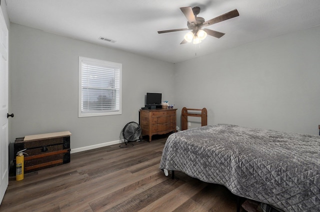 bedroom featuring ceiling fan and dark wood-type flooring