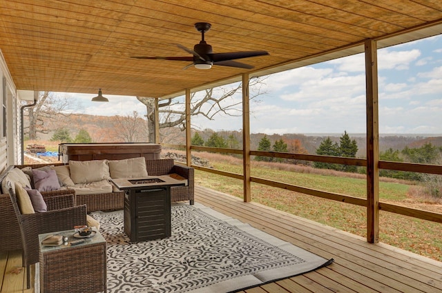 exterior space with ceiling fan and wood ceiling