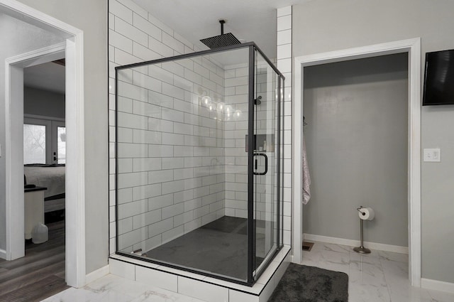 bathroom featuring french doors, walk in shower, and hardwood / wood-style floors