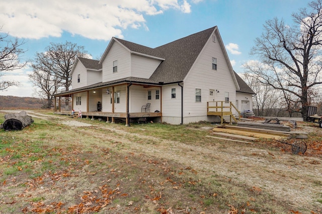 view of side of home with a yard