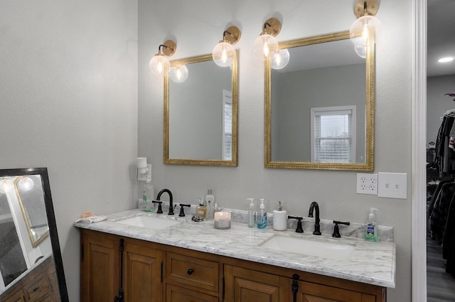 bathroom with hardwood / wood-style floors and vanity