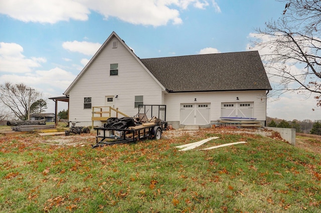 rear view of house featuring a yard