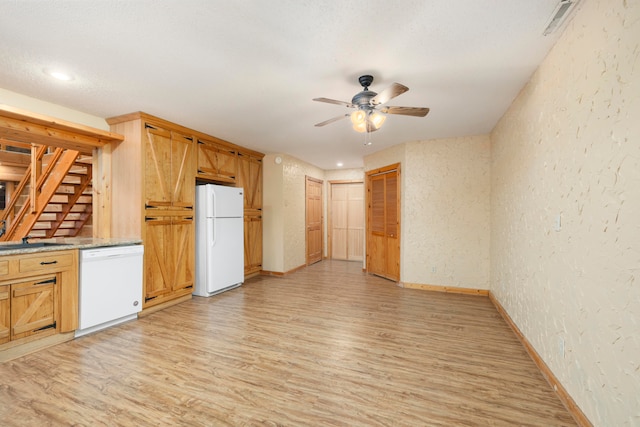 kitchen featuring ceiling fan, light hardwood / wood-style flooring, and white appliances