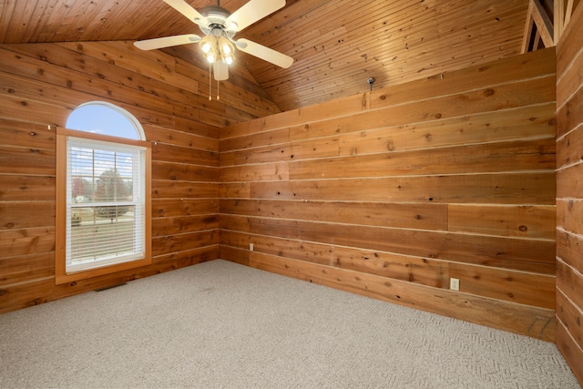 carpeted empty room with wood walls, ceiling fan, wood ceiling, and high vaulted ceiling