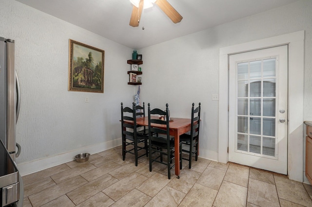 dining space with ceiling fan