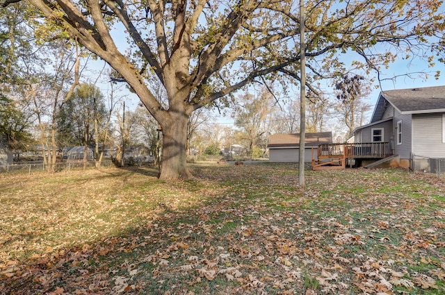 view of yard with a wooden deck