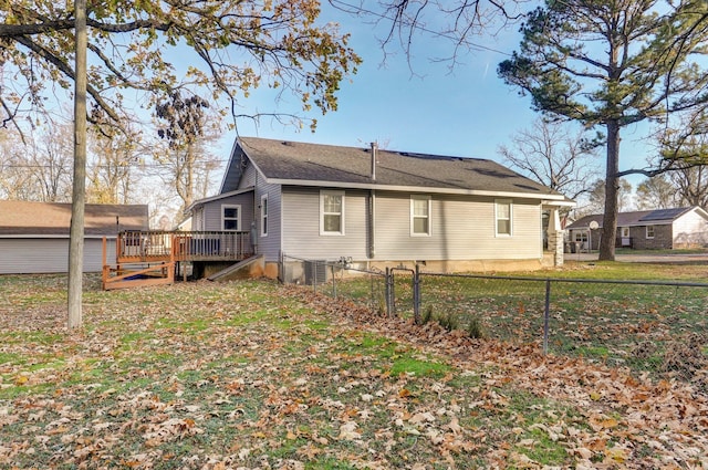 rear view of property featuring a deck