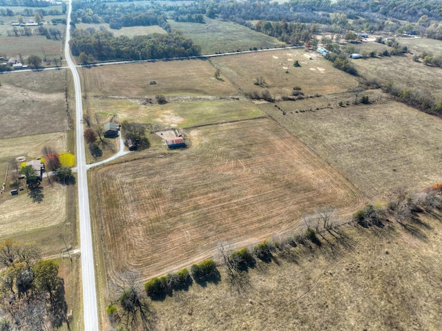 birds eye view of property with a rural view