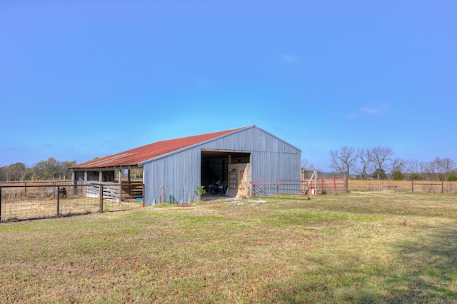 view of outbuilding with a yard and a rural view