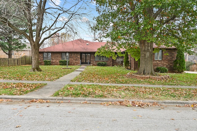 view of front of home with a front lawn