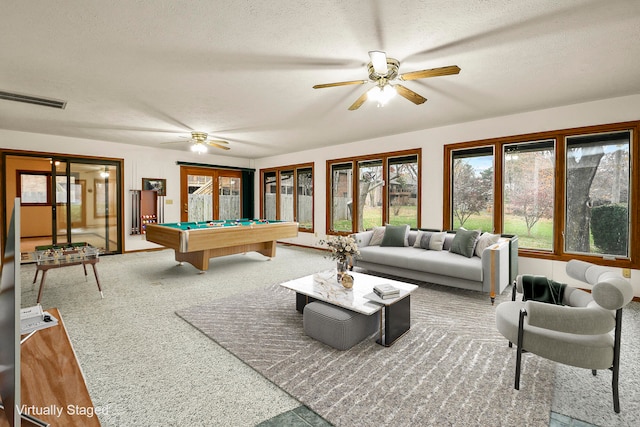 game room with carpet, french doors, a textured ceiling, ceiling fan, and pool table