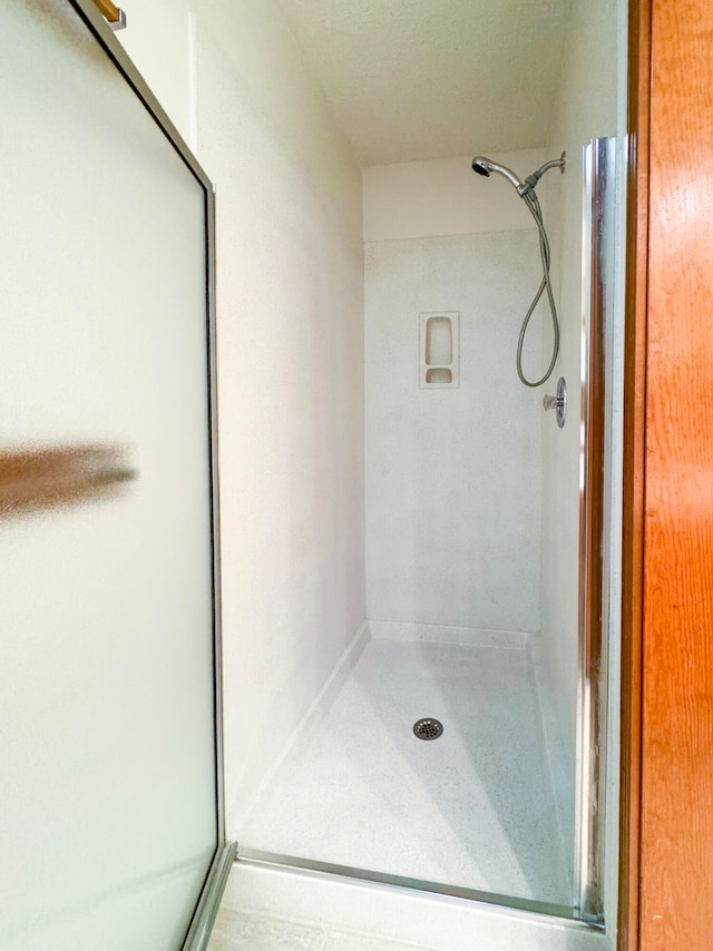 bathroom featuring walk in shower