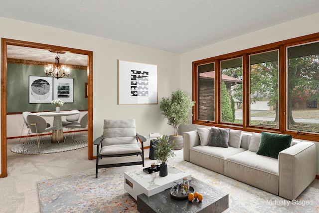 living room featuring a chandelier and light colored carpet