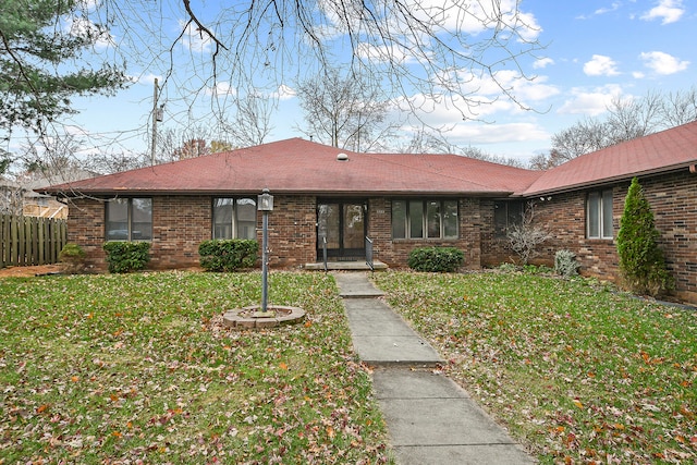 single story home with a front yard