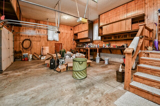 interior space with a workshop area and wooden walls