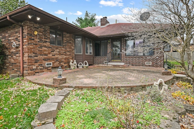 back of house with a patio