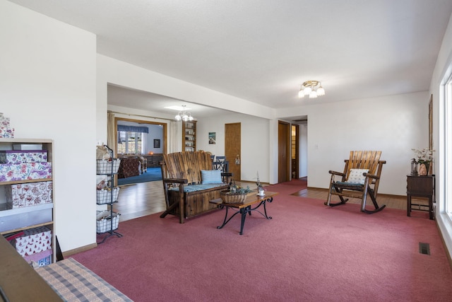 364 W Rd, Branson, MO 65616 - carpeted living room with a chandelier