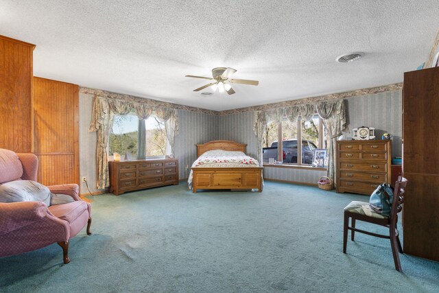 364 W Rd, Branson, MO 65616 - carpeted bedroom featuring wallpapered walls, multiple windows, a textured ceiling, and a ceiling fan