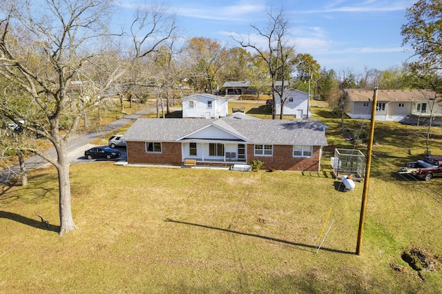 364 W Rd, Branson, MO 65616 - view of front of property with brick siding, a porch, a front yard, and roof with shingles